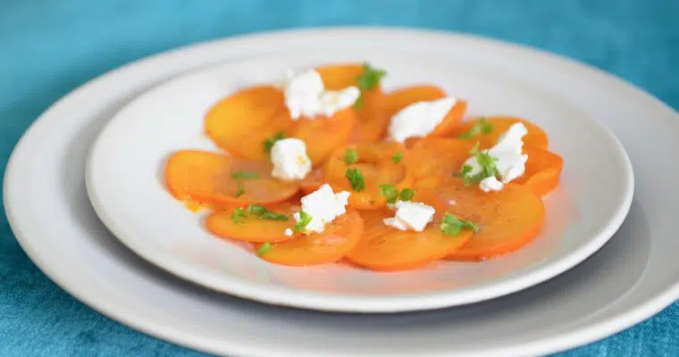 Persimmon goat cheese and roasted hazelnuts salad